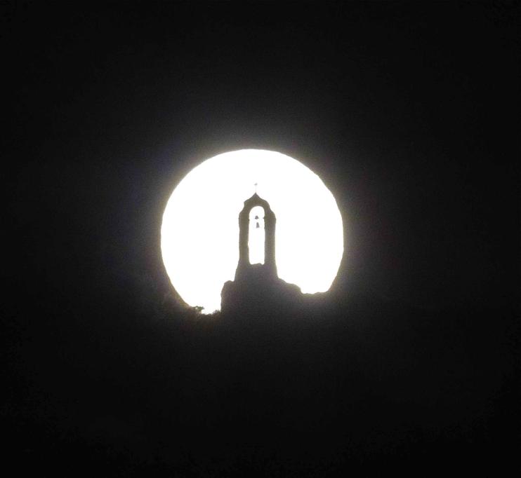 full moon behind 12 apostles church